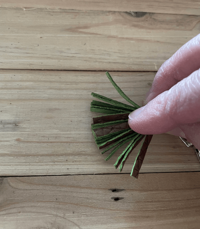 Pompon marron/vert